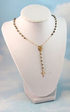 "This is a beautiful Rosary Inspired necklace with Miraculous center medallion. This gorgeous necklace is made of 6mm Gunmetal Crystals on a 14kt gold filled chain. Choose necklace length of 16\",18\" 20\", 22\",or 24\" (this is the measurement around the neck only, does not include the drop) . Spring clasp closure sits at back. Drop measurement is approximately 3\" and includes a 15mm cross pendant. This necklace comes nicely boxed, the perfect present. This necklace also comes in Sterling Silv Gold Cross Necklace Nickel Free, Gold Crucifix Necklace With Miraculous Medal, Nickel-free Gold Crucifix Jewelry, Rosary Inspired Necklace, Gold Rosary Necklace, 14kt Gold Jewelry, Crystal Rosary, Custom Rosary, Rosary Style Necklace