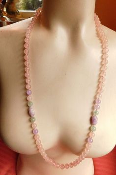 Lampwork bead necklace with mostly light pink beads...has a little darker purple and green accent colors - 30" length...can be doubled over Condition: Excellent AMERICAN VINTAGE CLASSICS RW039 Pink Hand-strung Round Beads Necklace, Pink Hand-strung Round Bead Necklaces, Pink Healing Faceted Bead Necklaces, Pink Faceted Beads Necklace For Healing, Healing Pink Faceted Bead Necklaces, Large Spiritual Pink Beads, Pink Large Beaded Long Necklace, Pink Spiritual Necklace With Faceted Beads, Long Pink Beaded Necklace With Faceted Beads