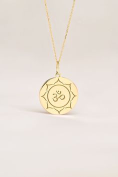 Om represents yoga, spirituality, and peace in body, in mid and spirit. This pendant is a meaningful gift for Birthdays, Anniversaries and Weddings. ● 14K SOLID GOLD ● FREE BACK SIDE PERSONALIZATION ● FREE SHIPPING  ● Inner diameter of the jump ring is 4mm ● Pendant thickness is 0.5mm 🇺🇸 All items are HANDMADE IN USA 🇺🇸 All materials are sourced from USA ● Chain Length Options    - Without Chain    - 40 cm / 16 inches    - 45 cm / 18 inches    - 50 cm / 20 inches ● Pendant Size Options    - Spiritual Medallion Jewelry With Si Clarity, Symbolic Round Pendant Jewelry For Meditation, Spiritual Round Pendant Necklace For Meditation, Spiritual Birth Flower Pendant Charm Necklace, Spiritual Birth Flower Pendant Necklace, Spiritual Medallion Jewelry, Personalized Spiritual Medallion Jewelry, Engraved Spiritual Necklaces For Healing, Spiritual Healing Medallion Necklace