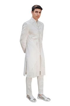 Ivory cotton silk sherwani in mirror and thread work. Paired with mirror work stole and pant.
Component: 3
Pattern: Embroidered
Type Of Work: Mirror work, Thread work
Neckline: Mandarin collar
Sleeve Type: Full sleeves
Fabric: Cotton silk
Color: White
Other Details: 
Pintuck detail
Note: inner kurta worn by the model is not for sale
Occasion: Groom - Aza Fashions White Mirror, Mirror Work, Thread Work, Full Sleeves, Embroidered Silk, Mandarin Collar, Cotton Silk, Aza Fashion, Full Sleeve