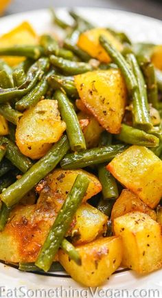 potatoes and green beans on a white plate