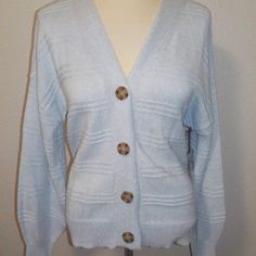 Cupcakes And Cashmere Misses Size Medium Fashion Cardigan Baby Blue In Color V-Neckline Button Front Seamed Detailing 60% Cotton 40% Polyester New With Tags Cpmer Light Blue Buttoned Cardigan For Fall, Blue Sweater With Button Closure For Layering, Light Blue Button Closure Sweater For Spring, Light Blue Sweater With Button Closure For Spring, Light Blue Buttoned Sweater For Winter, Light Blue Sweater With Button Closure For Fall, Spring Blue Sweater With Button Closure, Light Blue Cardigan With Button Closure For Winter, Spring Light Blue Cardigan With Button Closure