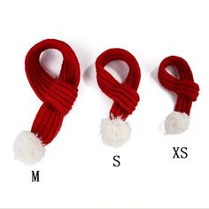 three red scarves with white pom - poms