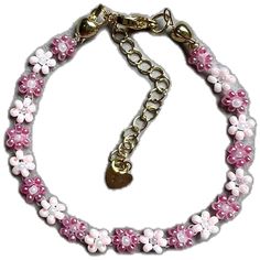 Pink Flower-shaped Beaded Charm Bracelet, Elegant Flower Crystal Bracelet For Spring, Elegant Flower Shaped Crystal Bracelet For Spring, Feminine Pink Jewelry With Handmade Flowers, Pink Flower-shaped Bracelet Gift, Elegant Pink Flower-shaped Bracelet, Elegant Pink Flower Bracelet, Elegant Pink Flower Shaped Bracelet, Elegant Pink Bracelet With Flower Charm