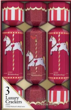 three red candles with white horses on them