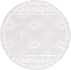 a round white rug with an intricate design