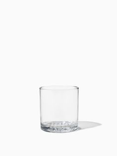 an empty glass sitting on top of a table