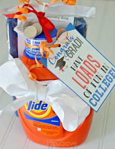 an orange container filled with toilet paper and other items