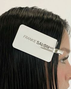 a close up of a person with a hair clip on their head and the name franie saeon on it