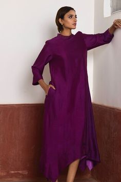 Purple dress with asymmetrical hem. Comes with purple Banarasi brocade jacket with woven floral patterns. - Aza Fashions Festive Asymmetrical Hem Party Dress, Festive Party Dress With Asymmetrical Hem, Elegant Silk Kurta For Work, Long Sleeve Silk Dresses For Occasions, Purple Silk Kurta For Party, Silk Long Sleeve Dresses With Side Slits, Elegant Floor-length Kurta For Spring, Elegant Purple Straight Kurta, Traditional Purple Evening Dresses