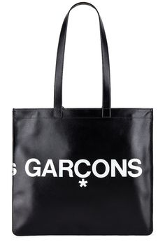 Find COMME DES GARÇONS Huge Logo Tote Bag on Editorialist. COMME des GARCONS Huge Logo Tote Bag in Black Smooth cow leather with twill lining. Made in Spain. Double shoulder straps measures approx 25 in length with a 10 drop. Measures approx 14W x 13H x 0.25D. Interior zip pocket. Printed logo detail. Gold foil logo detail. CMEX-UY39. SA9001HL. About the designer: The often avant-garde and always influential label was created by Kawakubo in Tokyo in 1969 before heading to Paris in 1981 where it garnered both acclaim and controversy with a debut collection of distressed and deconstructed pieces. The modern Comme des Garçons brand, which encompasses anentire family of sub-brands in fashion and fragrance, is worn by men and women who like to take an esoteric style stance. Black Calf Leather Shoulder Bag With Smooth Grain, Designer Black Shoulder Bag With Smooth Grain, Black Calf Leather Bag For Daily Use, Black Calf Leather Bag With Removable Pouch, Black Calf Leather Shopping Bag, Designer Black Bags With Smooth Grain, Black Shoulder Bag With Leather Lining And Coated Canvas, Chic Business Bags In Coated Canvas, Chic Coated Canvas Business Bag