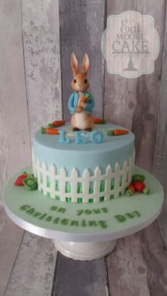 a cake decorated with a rabbit on top of it