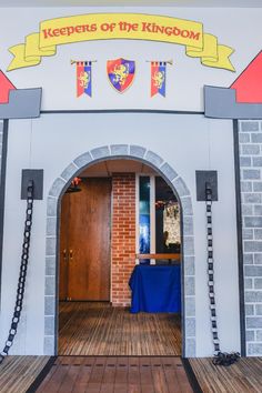 an entrance to the knights of the kingdom with a blue table cloth on it's side