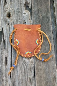 Beaded medicine bag  Drawstring medicine bag  Beaded buckskin pouch Beaded leather bag. $18.00, via Etsy. Beaded Leather Bag, Indian Medicine, Leather Medicine Bag, Medicine Bags, Native American Beadwork Patterns, Dream Weaver, Medicine Bag, Native American Beadwork, Indian Crafts