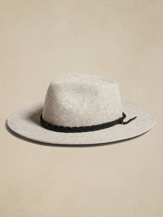 Handcrafted from 200-gram Argentine wool felt, this Hampui hat conjures up memories of markets in Marrakesh with it's braided leather trim.  HAMPUI: Rugged, yet always-refined, adventuresome Hampui hats are handcrafted from beautiful, sustainable materials that showcase the magic of the natural world.  Brim Width: 3. 25" Crown Height: 5" Small: 21. 7" (55cm) Medium: 22. 4" (57cm) Large: 23. 2" (59cm) X-Large: 24" (61cm) Adam Style, Hand Screen Printed, Braided Leather, Sustainable Materials, The Conjuring, Natural World, Leather Trim, Heather Gray, Wool Felt