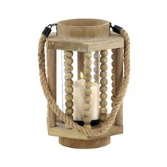 a wooden candle holder with rope around it and a white lit candle in the middle