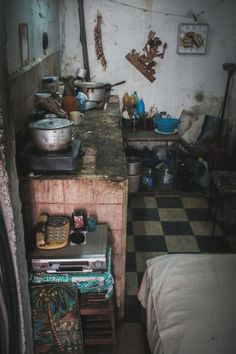 an old kitchen with lots of clutter on the counter