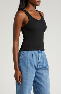 Perfect to layer or wear solo, this essential ribbed tank top is cut from a stretchy organic-cotton blend in a cropped silhouette. 20" length (size Medium) Scoop neck 95% organic cotton, 5% elastane Machine wash, line dry Imported Basic Cropped Ribbed Tank Top, Everyday Fitted Ribbed Tank Top, Fitted Ribbed Tank Top For Layering, Basic Ribbed Crop Top Tank, Basic Ribbed Crop Tank Top, Fitted Ribbed Tank Top For Everyday, Ribbed Fitted Cotton Tank Top, Cotton Ribbed Crop Top With Tank Straps, Ribbed Cotton Crop Top With Tank Straps