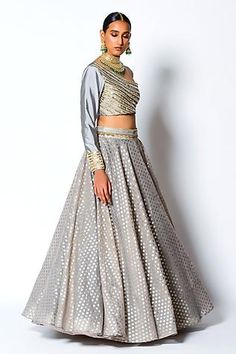 Grey lehenga in a chanderi silk base with woven floral motifs and embroidered waistband. Comes with embroidered one shoulder padded blouse.
Component: 2
Pattern: Woven and Embroidery
Type Of Work: Floral Motifs, Sequin and Pearl
Neckline: One Shoulder
Sleeve Type: Full Sleeves
Fabric: Chanderi Silk and Taffeta Silk
Color: Grey
Other Details: 
Blouse with sequin and pearl work
Closure: Side zip
Occasion: Destination Wedding - Aza Fashions Resham Embroidered Cotton Silk Choli For Reception, Designer Cotton Silk Choli With Gota Work, Bollywood Cotton Silk Choli For Reception, Cotton Silk Lehenga With Dupatta For Reception, Party Cotton Silk Choli With Sheer Dupatta, Silk Lehenga With Cutdana For Reception, Festive Cotton Silk Lehenga For Reception, Cotton Silk Lehenga For Diwali Reception, Cotton Silk Lehenga For Reception And Diwali