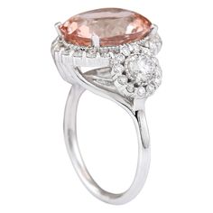 Stamped: 14K White Gold Total Ring Weight: 6.8 Grams Ring Length: N/ARing Width: N/A Gemstone Weight: Total Natural Morganite Weight is 5.91 Carat (Measures: 13.35x11.03 mm) Color: Peach Diamond Weight: Total Natural Diamond Weight is 1.30 Carat Quantity: 42 Color: F-G, Clarity: VS2-SI1 Face Measures: 16.50x19.75 mm Sku: [704124W] Peach Diamond, 14k White Gold Diamond Ring, Gold Diamond Ring, White Gold Diamond Rings, Morganite, White Gold Diamonds, Natural Diamonds, Gold Diamond, Diamond Ring