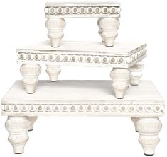 three white wooden tables stacked on top of each other