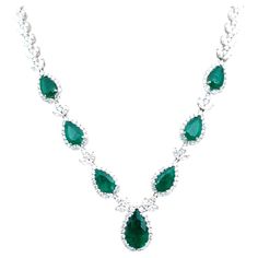 Check out this one-of-a-kind emerald necklace! The necklace features 7 natural Colombian emeralds weighing 10.25 ct and round brilliant cut diamonds weighing 17.3 ct set in 18k white gold. A gorgeous showstopper!! Pear-shaped Emerald Necklace For Formal Events, Exquisite Green Diamond Necklace For Formal Occasions, Luxury Hand Set Emerald Necklaces, Luxury Hand-set Emerald Necklaces, Luxury Emerald Pear-shaped Jewelry, Luxury Pear-shaped Emerald Necklace With Diamonds, Luxury Pear-shaped Diamond Emerald Necklace, Formal Bridal Necklace With 17 Jewels And Emerald, Luxury Pear-shaped Emerald Jewelry