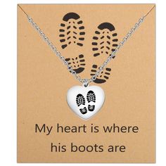 a card with two footprints and a heart on it that says, my heart is where his boots are