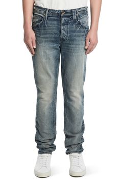 A tapered silhouette lends polished ease to casual jeans cut from stretch-kissed denim set with permanent wrinkles. Zip fly with button closure Five-pocket style 98% cotton, 2% elastane Machine wash, tumble dry Made in the USA Casual Fitted Jeans With Welt Pockets, Casual Slim Fit Jeans With Welt Pockets, Casual Tapered Selvedge Jeans, Casual Slim Fit Jeans With Button Closure, Casual Selvedge Tapered Jeans, Fitted Jeans With Button Closure And Straight Hem, Casual Tapered Five-pocket Jeans, Casual Slim Fit Selvedge Bottoms, Denim Set