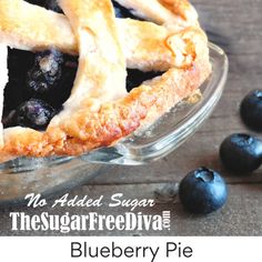 a blueberry pie in a glass dish with the words, no added sugar on it