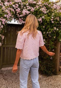 Pink embroidered short sleeve blouse that features a unique and trendy bow to tie on the front. This blouse does not offer lining but is not sheer - the perfect blouse to style up or down all spring and summer long. Our models also wear the Light Blue Maddie Jeans. Sizes: S-M / M-L S-M: Length 20.87 in - Width 18.50 in M-L: Length 21.65 in - Width 19.29 in 50 % cotton, 50 % polyester Washing: handwash Trendy Summer Blouse With Half Sleeves, Summer Half Sleeve Tops For Day Out, Casual Floral Embroidered Short Sleeve Blouse, Trendy Puff Sleeve Short Sleeve Top For Summer, Trendy Puff Sleeve Top For Summer, Spring Tops With Floral Embroidery And Half Sleeves, Trendy Summer Short Sleeve Puff Top, Casual Short Sleeve Blouse With Floral Embroidery, Spring Floral Embroidered Short Sleeve Tops