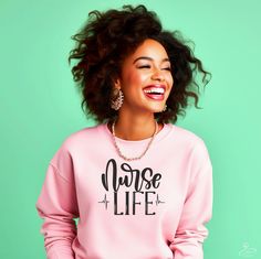 Celebrate the dedication and compassion that defines the noble profession of nursing with our "Nurse Life" sweatshirt. Designed for unbeatable comfort and a relaxed fit, this sweatshirt makes an ideal gift for nurses or anyone who appreciates their hard work. Crafted from soft, high-quality fabric, it's perfect for wearing on chilly hospital shifts or cozy evenings at home. Show your pride for the nursing profession with this stylish and practical wardrobe essential. Purchases above $35 are eligible for free shipping! 👇📦 HOW TO ORDER 📤 1️⃣ Select Type and Size 2️⃣ Select Color (see color chart picture for preview)   3️⃣ Add to cart 4️⃣ Repeat 1-3 to add additional items to your cart 👕📏 SHIRT SIZING & MATERIAL 👚 🌺Gildan Sweatshirt 🌺 In search of the ultimate fusion of timeless fashi Nursing Profession, Gildan Sweatshirts, Nurse Life, Comforters Cozy, Hard Work, Custom Clothes, Ideal Gift, Sweat Shirt, Timeless Fashion