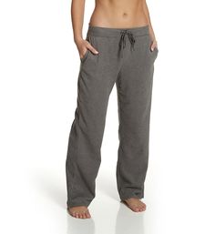 This extra comfy lounge pant is made from a soft fleece with a relaxed fit for ultimate coziness. Made from polyester and spandex for stretch. Wide, covered elastic waistband adjusts with flat, woven drawstring for the perfect fit. Drawstring has coated metal end caps. Large pockets at the side seams for convenience. Center back seam gives the fit definition. Cuddl Duds logo embroidered above the left leg hem. Wide, straight legs have self-lined hems. High waisted for modern look. Full length. R Comfy Relaxed Fit Pants For Relaxation, Comfortable Pants For Relaxation, Comfortable Yoga Pants With Pockets For Loungewear, Comfort Waistband Yoga Pants For Lounging, Solid Color Yoga Pants With Comfort Waistband For Relaxation, Comfortable Sweatpants With Comfort Waistband, Comfy Activewear Long Pants For Lounging, Comfy Activewear For Lounging, Comfortable Relaxed Fit Yoga Pants For Loungewear