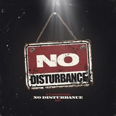 a sign hanging from a rope with the words no distubrangce on it