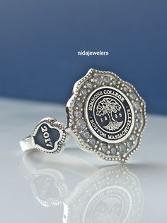 This product is GUARANTEED for life. * College graduation rings for men and women delicately engraved with your school logo or any other initials or image you want. * The ring has solid back. Deep and detailed engraving very delicately handcrafted unisex - looks super cool on both women & men * The ring is 925 Silver * Please contact me for your 14 carat and 18 carat solid gold requests. I can gladly do. * Certified 14k solid gold, hallmarked 14k for solid gold rings. * The ring has solid ba Personalized Silver Crystal Ring, Personalized Sterling Silver Diamond Ring For Gift, Personalized Sterling Silver Diamond Ring Gift, Personalized Sterling Silver Diamond Ring, Sterling Silver Open Signet Ring For Anniversary, Silver Engraved Ring With Center Stone For Gift, Sterling Silver Signet Promise Ring With Center Stone, Sterling Silver Engraved Ring With Center Stone For Promise, Adjustable Stamped 925 Signet Wedding Ring