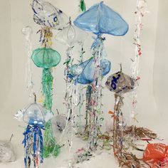 jellyfish and other sea creatures made out of plastic bottles are shown in this image