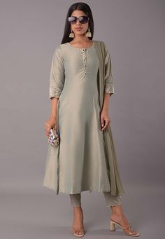 This attire with Cotton Lining is Enhanced with Buttons, Stone and Zari Work. Crafted in Round Neck and Quarter Sleeve, Available with a Cotton Silk Pant with elastic closing and a Faux Chiffon Dupatta. The Kameez and Bottom Lengths are 48 and 36 inches respectively Do note: Accessories shown in the image are for presentation purposes only and length may vary upto 2 inches.(Slight variation in actual color vs. image is possible). We sell all kinds of salwar kameez sets for women Georgette Salwar Kameez | Crepe Salwar Kameez | Art Silk Salwar Kameez | Velvet Salwar Kameez | Chiffon Salwar Kameez | Net Salwar Kameez | Zari Work Salwar Suits | Indian Festival Wear Suits | Indian Wedding Outfit | Indian Party Wear Dresses | Indian Dresses On Discount | Indian Traditional Salwar Kameez | Ethnic Indian Designer Suits Party Wear, Silk Suit Designs Indian, Suit Neck Designs Indian, Party Wear Dresses Indian, Salwar Suits For Women, Indian Party Wear Dresses, Wedding Outfits Indian, Suit Neck Designs, Suits Indian