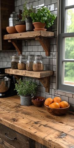 the kitchen counter is made out of wood and has two shelves with plants on them