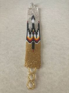 a beaded keychain with an ornament on it