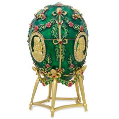 an ornately decorated green egg with gold trimmings