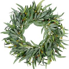 a wreath made out of green leaves and berries