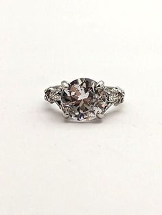 Vintage ladies ring is set with a large clear glass gem. Perfect statement ring for parties, or a promise ring as a gift. This ring is a size 5 1/2. Bundle and save. Free shipping on orders over $34.99  Find more rings at https://www.etsy.com/shop/FunandFancyVintage?ref=seller-platform-mcnav&section_id=36379680 Please visit our shop for more Fun and Fancy Jewelry!  www.etsy.com/shop/FunAndFancyVintage Vintage Jewelry Bling Ring, Ladies Ring, Glass Gems, Fancy Jewelry, Bling Rings, Ring Vintage, Promise Ring, Solitaire Ring, Statement Ring