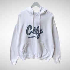 Vintage City Football White Hoodie Sweatshirt Size Medium City Football Crewneck City Football Sweater Pullover Spell Out Print Logo Jumper by brixtonclothing on Etsy White Cotton Hoodie Sweater, White Long Sleeve Sweater With Letter Print, White Oversized Varsity Sweatshirt, Oversized White Varsity Sweatshirt, White Fall Sweater For College, White Varsity Sweater For Streetwear, White Hooded Sweater With Letter Print, White Letter Print Sweatshirt For Winter, White Hoodie For College In Fall