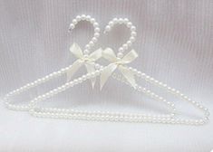 10 Pack Pearl Beads Metal Elegant Clothes Hangers Standard Hangers (White) Elegant Design: Round metal hangers with pearl beads for a stylish look Durable Material: Made from metal and plastic for long-lasting use Multiple Uses: Can be used for hanging clothes, scarves, bags, and more Compact Size: Measures 16 inches with 10 hangers for convenient storage Brand Name: Part of the BUUEERR brand's collection of home accessories Pearl hangers is luxury,top quality transparent beads decoration. Shipping We offer FREE shipping on all orders! We ship within Three business days of payment, usually sooner. We use a selection of shipping services such as UPS, FedEx, USPS etc., unable to choose a carrier.  We only ship to the lower 48 states, no APO/FPO addresses or PO Boxes allowed. Sellers generall Coquette Pics, Pearl Hangers, Coquette Widgets, Moth Girl, Pearl Hanger, Best Hangers, Magic Clothes, White Hangers, Space Saving Hangers