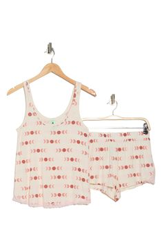 Stay chic and cozy in these palm patterned pajamas that pair a breezy tank and shortie shorts. Top: 24.25" length (size Small); pants: 14.5" leg opening; 11.5" front rise; 14.5" back rise (size Small)
 Top has scoop neck, tank straps Bottoms have elastic banded waist 95% rayon, 5% spandex Machine wash cold, lay flat to dry Imported Model stats: 5'10", 32" bust, 25" waist, 36" hip. Model is wearing size Small. Printed Pajama Shorts For Summer Pajama Party, Summer Printed Sleepwear For Loungewear, Printed Summer Pajama Shorts, Comfortable Summer Pajama Shorts For Bedtime, Printed Summer Sleepwear For Bedtime, Comfortable Summer Pajama Shorts For Sleep, Comfortable Summer Sleep Pajama Shorts, Printed Pajama Shorts For Summer Loungewear, White Summer Sleepwear For Lounging