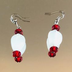 Red and white handmade beaded earring for all occasions White Faceted Beads Beaded Earrings Gift, White Faceted Beaded Earrings As A Gift, White Dangle Earrings With Faceted Beads, White Beaded Earrings With Faceted Round Beads, White Faceted Beaded Round Earrings, White Faceted Beads Drop Earrings, White Round Beaded Earrings With Faceted Beads, Handmade White Earrings For Christmas, Handmade White Christmas Earrings