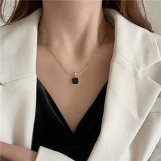 Description: Embrace luxurious elegance with our Black Square Pendent Necklace. Made with high quality materials, this necklace boasts an eye-catching gold plated pendant that elevates any outfit. The perfect addition to your jewelry collection, it adds a touch of sophistication and glamour to your style. Affordable Luxury Jewelry High-Quality Gold Plating Versatile for Daily Wear Perfect Gift for Women Quiet Luxury and Individuality Combined Oil Drip, Black Pendant Necklace, Square Necklace, Shopping Party, Moda Chic, Wedding Party Jewelry, Travel Shopping, Chain Fashion, Estilo Punk