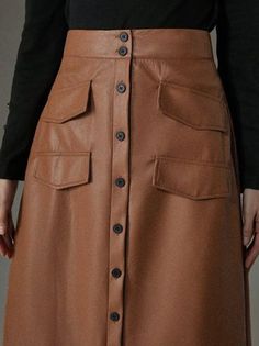 Spring Faux Leather Skirt With Pockets, Brown Office Skirt With Pockets, Fall Leather Skirt With Button Closure, Fitted Leather Mini Skirt With Pockets, Office Mini Skirt In Brown For Spring, Brown Office Mini Skirt For Spring, Brown Mini Skirt For Office In Spring, Fall Knee-length Mini Skirt With Pockets, Brown Knee-length Skirt With Button Closure