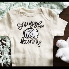 Custom Imprinted Onesie Designs Galore Text Style Galore Colors Available Two Different Mediums Where Used Here Sublimation On The Muted-Softly Water Color Design On Cotton And Vinyl Heat Transfer On Others. Both Are A Cozy Addition To A Baby’s Daily Wear. Baby Onsie Decorating Ideas, Baby Onesies Cricut, Diy Baby Onesies, Snuggle Bunny, Geometric Lion, Unisex Onesies, Nautical Baby, Lettering Style, Diy Baby