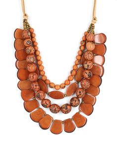 Discover the beauty of nature with this exquisite multi-layered necklace. Made with sustainable Tagua nut, Bombona seeds, and Acai berries, this adjustable necklace offers a versatile length of 16" to 29", perfect for any style. Made with sustainable Tagua nut, Bombona seeds, and Acai berries Faux Leather cord Colored using vegetable dyes Handcrafted in Ecuador Adjustable Natural Jewelry With Wooden Beads, Adjustable Natural Wooden Bead Jewelry, Adjustable Natural Wooden Beaded Jewelry, Adjustable Wooden Beads Necklace In Nature-inspired Style, Adjustable Nature-inspired Jewelry With Wooden Beads, Unique Adjustable Natural Color Necklace, Adjustable Nature-inspired Wooden Beads Jewelry, Adjustable Multi-strand Necklace With Polished Beads, Adjustable Multi-strand Polished Beads Necklace