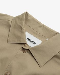 The Suzy Shirt is a part of the Deus Ex Machina 2022 Women's Spring Capsule Collection.This relaxed fit short sleeve military shirt features:● Branded label on chest pocket● Corozo nut button closure● 2 large chest patch pockets with pocket flaps● 98% cotton 2% spandex fabrication● Enzyme wash Designed and tested at the Deus House of Simple Pleasures, Camperdown, Sydney. Military Shirt, Spring Capsule, Deus Ex Machina, Ex Machina, Capsule Collection, Simple Pleasures, Workout Shorts, Chest Pocket, Patch Pocket